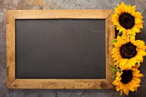 Fall chalkboard frame with pumpkins photo