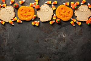 Halloween pumpkin cookies and candy photo