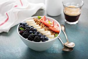 Yogurt bowl with banana and berries photo