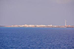 View of a city by the ocean photo