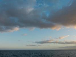 Sunset over the ocean photo