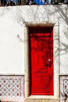 Red door in Lisbon, Portugal photo