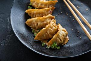 Fried potstickers with green onions photo