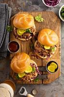 Pulled pork sandwiches with cabbage and pickles photo