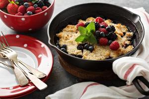 Berry crumble in a cast iron pan photo