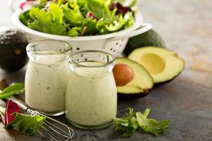 Avocado ranch dressing in small jar photo