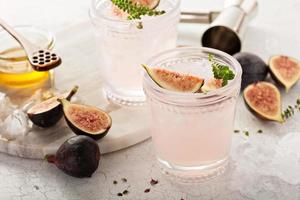 Pink fig cocktail with honey and thyme photo
