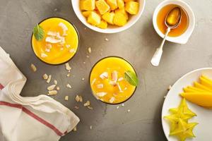 Mango smoothie with honey and coconut photo