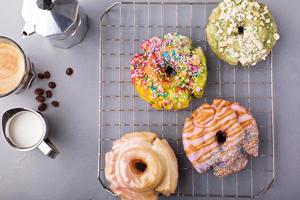 Variety of donuts on a cooling rack photo