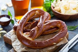 Freshly baked pretzels with beer photo