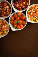 Halloween candy in white bowls photo