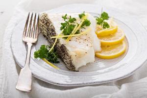 Grilled stripped bass with lemon and herbs photo