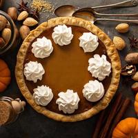 Pumpkin pie with whipped cream photo