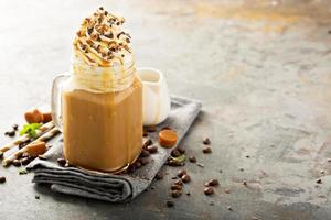 Caramel iced latte with whipped cream photo