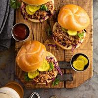 Pulled pork sandwiches with cabbage and pickles photo