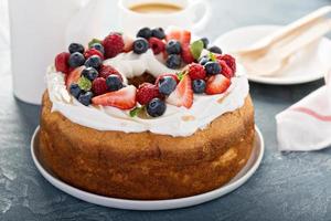 Angel food cake with cream and berries photo