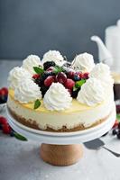 Classic New York cheesecake decorated with whipped cream photo