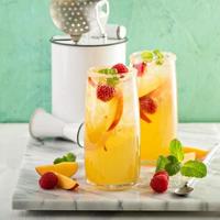 Colorful refreshing cold summer drink with peaches photo