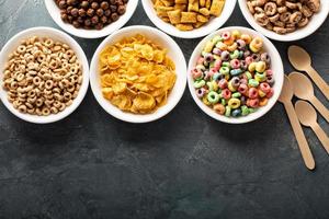 Variety of cold cereals in white bowls photo