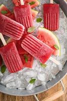 Watermelon and strawberry popsicles photo