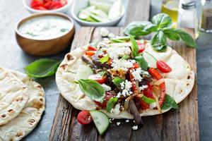 Flatbread with beef and vegetables photo