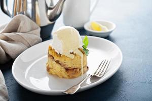 Apple bread pudding with vanilla ice cream photo