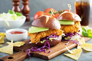 Chicken tender sandwich with avocado and slaw photo