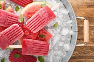 Watermelon and strawberry popsicles photo