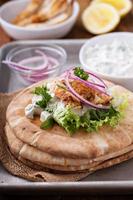 Chicken pita sandwich with cucumber sauce photo