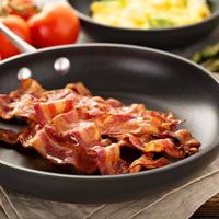 Cooked bacon on a skillet photo