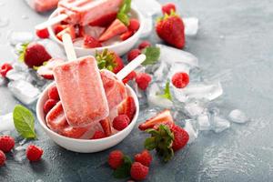 Strawberry and raspberry popsicles photo