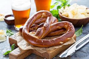 Freshly baked pretzels with beer photo