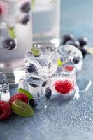 Ice cubes with berries and mint