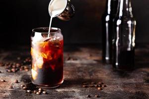 Cold brew iced coffee in glass bottles photo