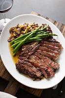 Beef steak with asparagus and mushrooms photo