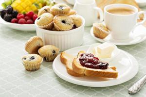 Fresh and bright continental breakfast table photo