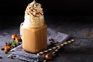 Caramel iced latte with whipped cream photo