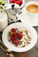 Quinoa porridge with raspberry and coconut flakes photo