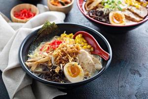 Spicy ramen bowl with noodles and chicken photo