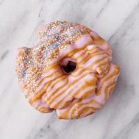 Lavender caramel donut closeup on marble photo