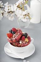 Berry shortcake donuts in a white cup photo