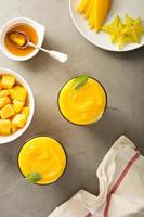 Mango smoothie with honey and coconut photo