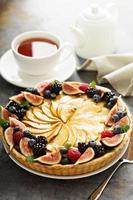 French apple tart decorated with berry photo