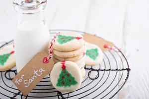 Christmas tree cookies with milk photo