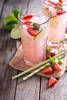 Strawberry lime lemonade in tall glasses photo