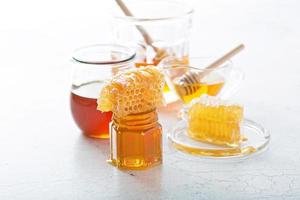 Various types of honey and honeycomb photo
