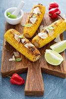 Grilled corn with chili and cheese photo