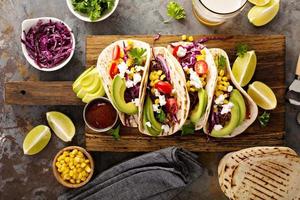 Pulled pork tacos with red cabbage and avocados photo