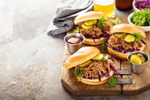 Pulled pork sandwiches with cabbage and pickles photo