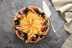 French apple tart decorated with berry photo